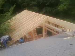 Framing a new roof addition that ties into an existing shingle roof in Newport